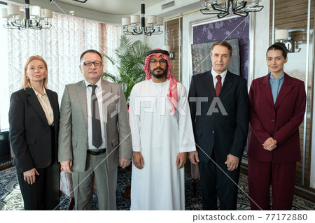 A group of people posing for a photo A group of people posing for a photo 77172880