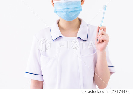 Nurse with toothbrush 77174424