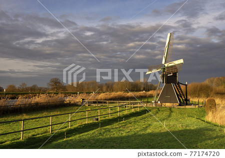 The Follega windmill just before a heavy shower The Follega windmill just before a heavy shower 77174720