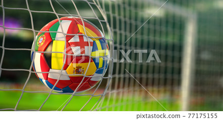 Football ball with flags of european countries in the net of goal of football stadium. Euro championship 2021. 77175155