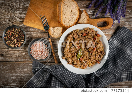Bigos - sauerkraut stewed with meat, dried mushrooms and sausage. 77175344