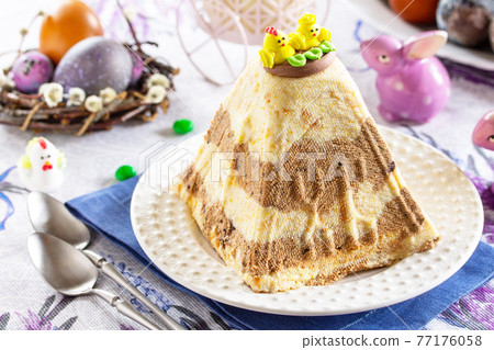 Easter cottage cheese with chocolate-cream filling and dried apricots. 77176058