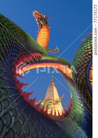 Serpent statue sculpture of chedi stupa pagoda Buddhism in Wat Phra That Nong Bua Dhammyuttika temple, Ubon Ratchathani district, Thailand. 77178173