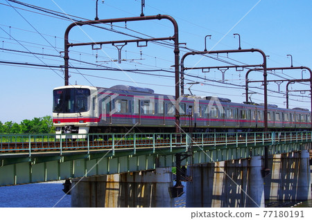 Keio Line passing through the Tamagawa Bridge 77180191
