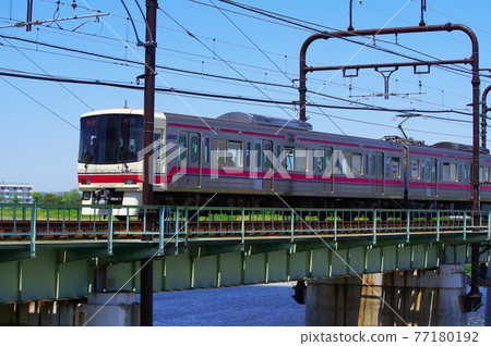 Keio Line passing through the Tamagawa Bridge 77180192