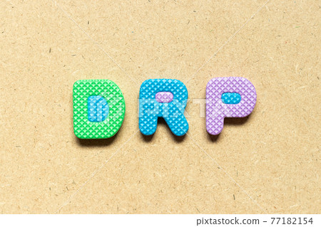 Foam alphabet letter in word DRP (Abbreviation of Disaster recovery plan, Distribution resource planning, Dividend reinvestment plan, Direct Repair Program or Digital Remaster Processing) on wood 77182154