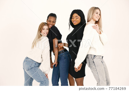 Portrait of attractive young women on a white background Portrait of attractive young women on a white background 77184269