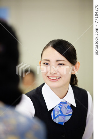 Bank clerk window business image Bank clerk window business image 77184270