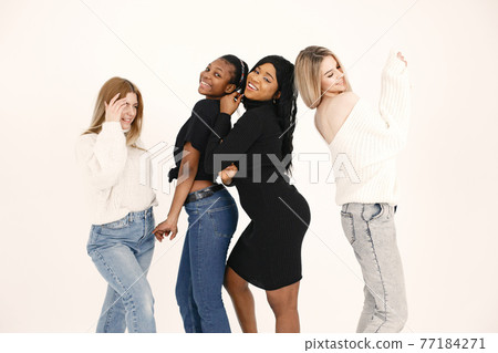 Portrait of attractive young women on a white background Portrait of attractive young women on a white background 77184271