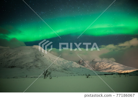 A night of soft sky colors and colorful aurora borealis A night of soft sky colors and colorful aurora borealis 77186067