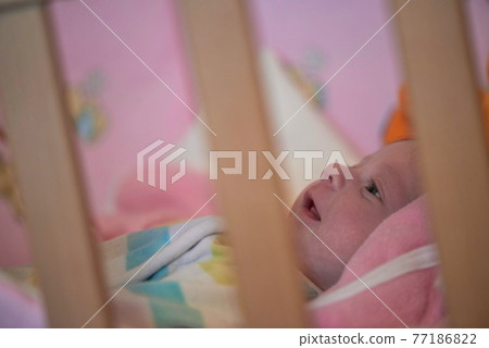 happy newborn little baby smilling 77186822