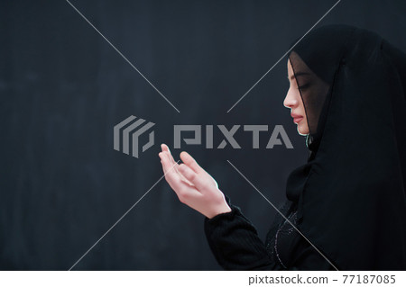 Portrait of young Muslim woman making dua Portrait of young Muslim woman making dua 77187085