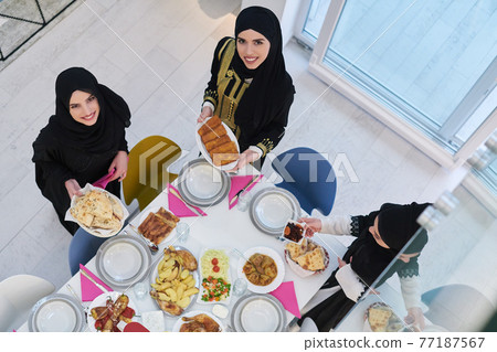 Top view of young muslim women preparing food for iftar during Ramadan 77187567