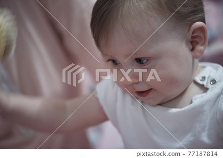 cute little newborn baby smilling 77187814