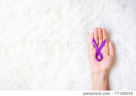 Pancreatic Cancer, world Alzheimer, epilepsy, lupus and domestic violence day Awareness month, Woman holding purple Ribbon for supporting people living. Healthcare and World cancer day concept Pancreatic Cancer, world Alzheimer, epilepsy, lupus and domestic violence day Awareness month, Woman holding purple Ribbon for supporting people living. Healthcare and World cancer day concept 77188056