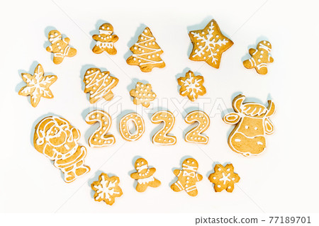Gingerbread cookies in the form of numbers, gingerbread New Year 2022 festive decor on white background . 77189701