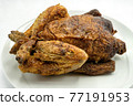 A genuine roast chicken on a white plate. Perfect shot for healthy diets, cooking and breeding. 77191953