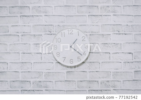 Clock wall hanging brick background Clock wall hanging brick background 77192542