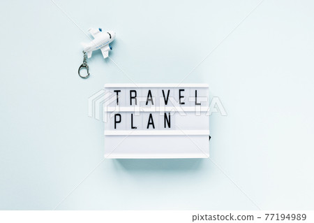 Text TRAVEL PLAN and airplane. Copy space Text TRAVEL PLAN and airplane. Copy space 77194989