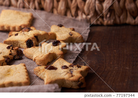 Healthy homemade cookies on wooden background Healthy homemade cookies on wooden background 77197344