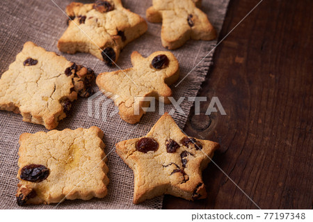 Healthy homemade cookies on wooden background Healthy homemade cookies on wooden background 77197348