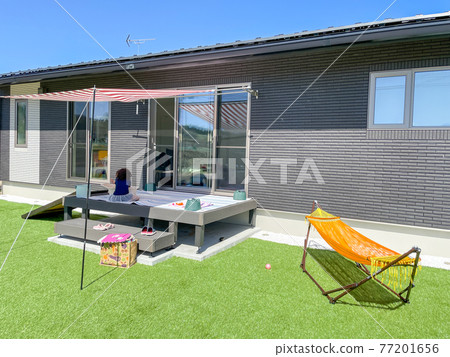 House with lawn garden and wooden deck 77201656