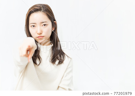 A woman pointing to the front 77201979