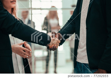 close up. business people greeting each other with a handshake. 77202033