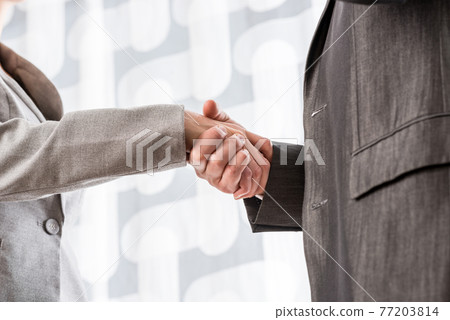 Business handshake closeup Business handshake closeup 77203814