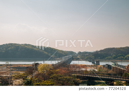 Imjingang River and mountains from Imjingak Pyeonghoa-Nuri park in Paju, Korea 77204328