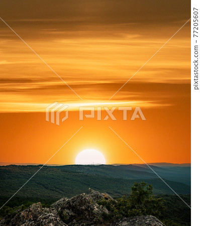 Orange sunset with text space over the mountain range 77205607