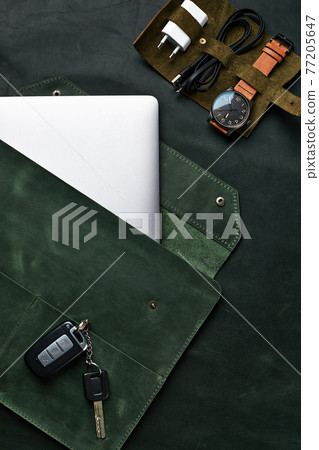 Set of handmade leather goods, key holder rings, wallet, purse, notepad, handbook. Handcrafted leather goods, close-up 77205647