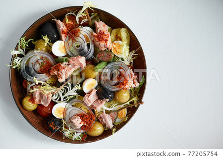 Tuna salad with olives, eggs and onions Tuna salad with olives, eggs and onions 77205754
