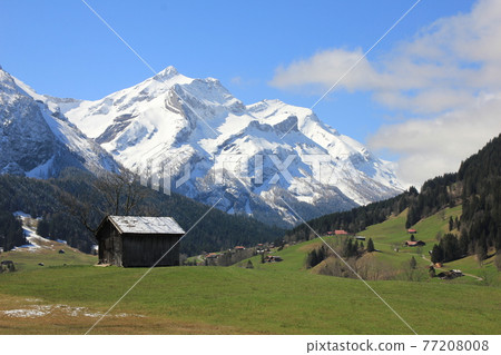 Old shed and snow covered mountain Oldehore. Old shed and snow covered mountain Oldehore. 77208008