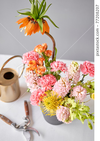 Finished flower arrangement in a vase for home. Flowers bunch, set for interior. Fresh cut flowers for decoration home. European floral shop. Delivery fresh cut flower. Finished flower arrangement in a vase for home. Flowers bunch, set for interior. Fresh cut flowers for decoration home. European floral shop. Delivery fresh cut flower. 77208207