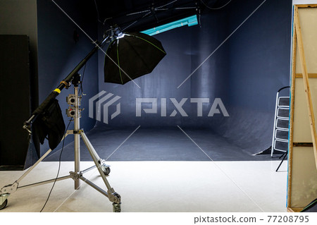 Empty photo studio with lighting equipment. Photographer workplace interior with professional tool set gear. Flash light black background scenes ready for studio shooting. Modern photographer studio Empty photo studio with lighting equipment. Photographer workplace interior with professional tool set gear. Flash light black background scenes ready for studio shooting. Modern photographer studio 77208795