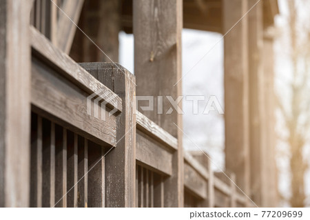 Wooden terrace. Supports and columns. Wood texture and peeling paint 77209699