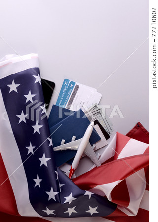 Romantic Airplane Travel preparation Concept objects, documents, dollars, passports, boarding pass tickets, glasses, smartphone, and space for text. Romantic Airplane Travel preparation Concept objects, documents, dollars, passports, boarding pass tickets, glasses, smartphone, and space for text. 77210602