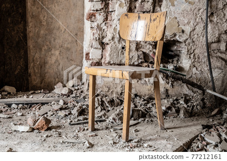 Old wooden chair in devasted abandoned room Old wooden chair in devasted abandoned room 77212161