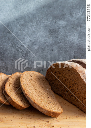 Bread in basket on marbled background 77213268