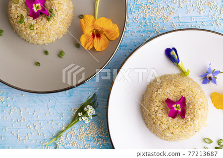 Quinoa plate presentation decorated with edible flowers Quinoa plate presentation decorated with edible flowers 77213687