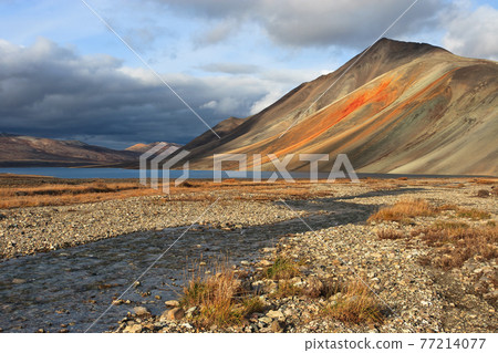 Autumn landscape with creek, lake and mountain 77214077
