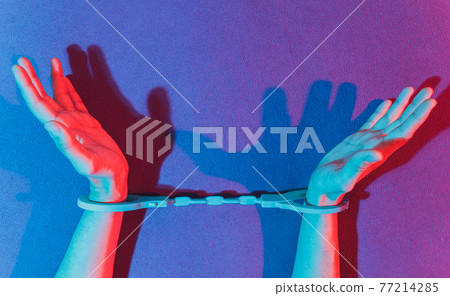 male and female hand in handcuffs. couple in bed. sex Toys. 77214285