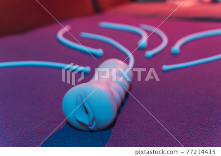 Vibrator for relaxation and pleasure.Vibrator for sex games. Vaginal exercise machines for intimate.Vibrator toys for adults. Sex toys. vibration work and artificial vagina. sex games concept. 77214415