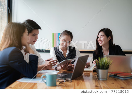 Fund managers team consultation and discuss about analysis Investment stock market by digital tablet. Fund managers team consultation and discuss about analysis Investment stock market by digital tablet. 77218015
