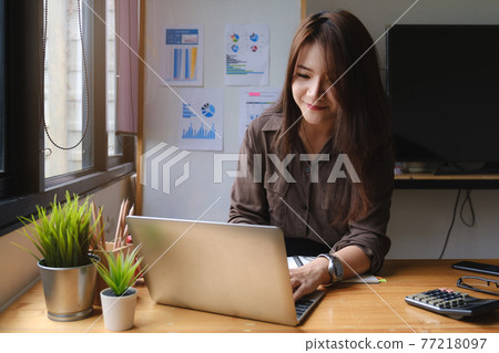 Beautiful businesswoman talking by video conference with her business team. work from home concept. Beautiful businesswoman talking by video conference with her business team. work from home concept. 77218097