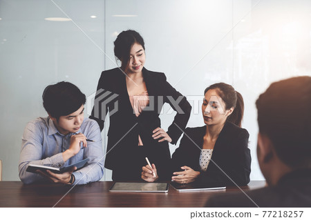 Fund managers team consultation and discuss about analysis Investment stock market by digital tablet. Fund managers team consultation and discuss about analysis Investment stock market by digital tablet. 77218257