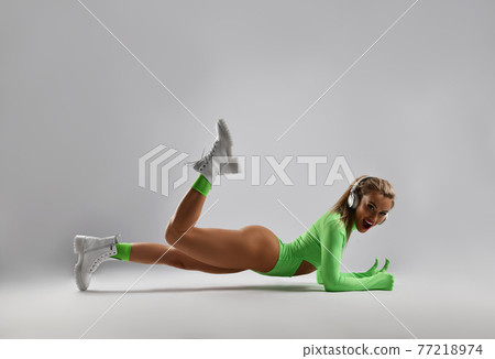 Happy smiling blonde fitness woman in stylish 77218974