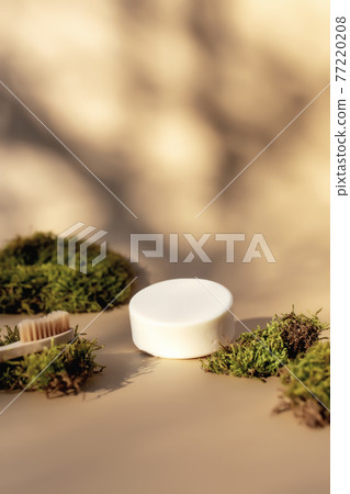 Healthcare concept with bath accessories on beige background with green moss Healthcare concept with bath accessories on beige background with green moss 77220208