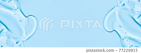 Transparent hyaluronic acid gel on a blue background. Transparent hyaluronic acid gel on a blue background. 77220915